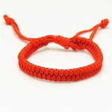 Delysia King   Red string bracelet